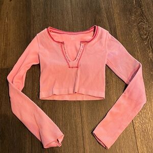 Bright pink long sleeve crop top